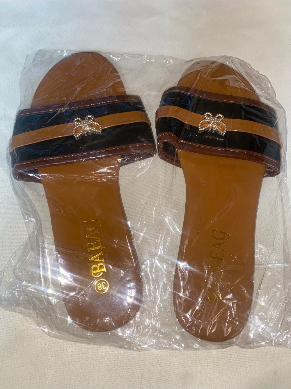 Two-Tone Brown and Black Slide Mules with Gold Bee Accent